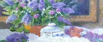 Image of brightly coloured violet coloured lilacs in a copper pot