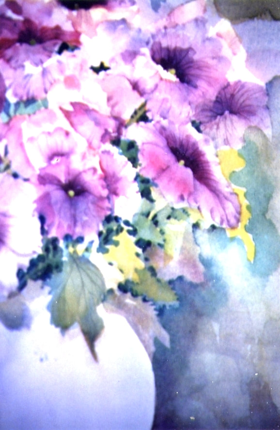 View of just a half of the bouquet of purple petunias is a blue vase